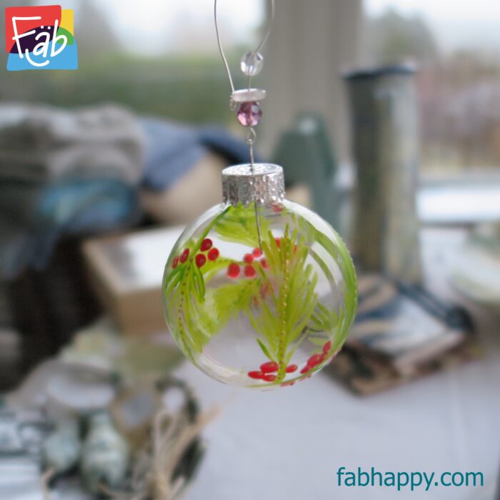 a close up of the bauble hanging from a stand